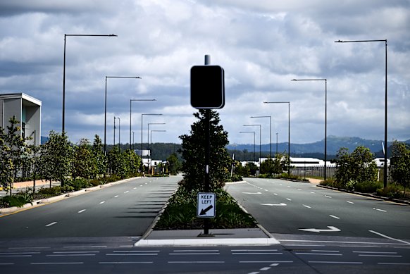 An empty road in a yet-to-be-built section of the Aura subdivision on the Sunshine Coast. When finished, it will see a town the size of Shepparton or Port Macquarie tucked between the beach and the Bruce Highway.