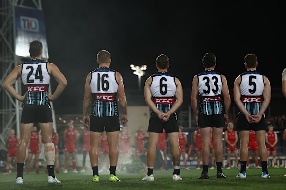 Port Adelaide and Gold Coast players stood as one for the Welcome to Country and cultural ceremony before their Sir Doug Nicholls Round match in Darwin earlier this month.