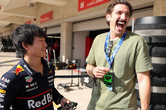 Comedian Andrew Schulz, right, with Yuki Tsunoda of Japan and Oracle Red Bull Racing before the F1 Grand Prix of United States at in Texas last month.