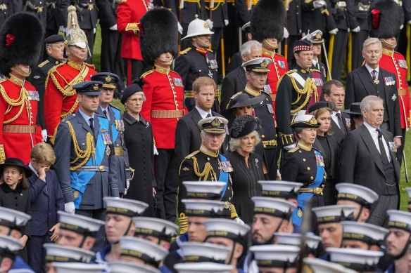 Prince Andrew, Princess Beatrice, Princess Anne, Camilla, the Queen Consort, Britain’s King Charles III, Meghan, Duchess of Sussex, Prince Harry, Prince William, Prince George and Princess Charlotte watch as the coffin of Queen Elizabeth II is placed into the hearse following the state funeral service in Westminster Abbey.