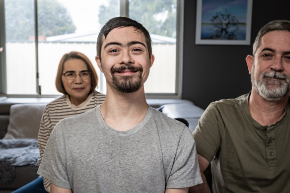 Mark and Keiko Gray are the parents of 23-year-old Ken with Down syndrome. Ken’s NDIS funding was almost halved without explanation.