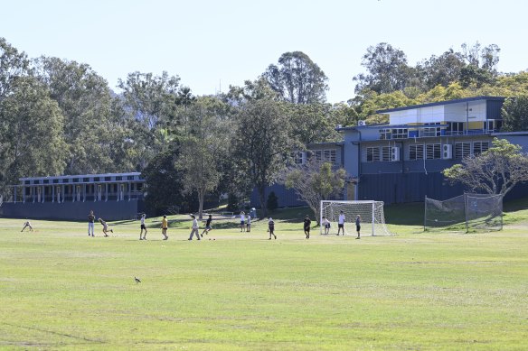 Indooroopilly State High parents would rather lose green space at the school as opposed to converting the library and other spaces into temporary classrooms.