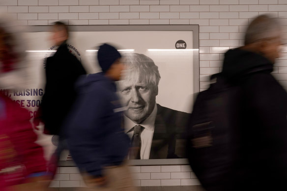 The face of former British Prime Minister Boris Johnson on an advertising hoarding at Westminster tube station in London, on October 21, 2022.