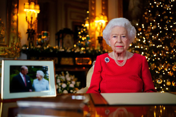 The Christmas message is pre-recorded on December 23. The photograph on the desk is of the Queen and the Duke of Edinburgh, taken in 2007 at Broadlands, Hampshire, to mark their diamond wedding anniversary.