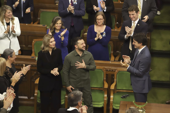 Ukrainian President Volodymyr Zelensky receives a standing ovation from Canadian Prime Minister Justin Trudeau.