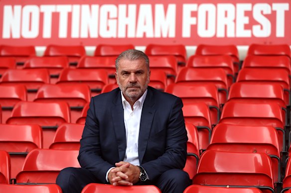 Ange Postecoglou poses for photos after being appointed Nottingham Forest head coach.