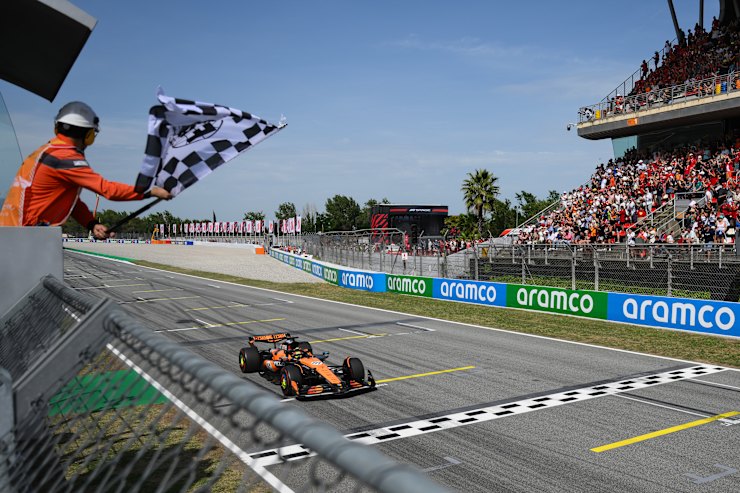 Oscar ‍Piastri celebrates winning the Spanish Grand Prix at the Barcelona-Catalunya circuit.
