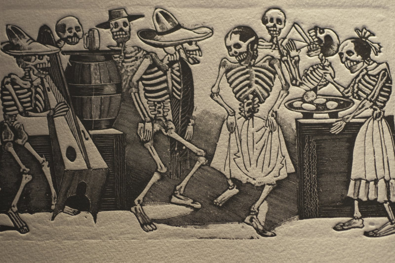 woodprint of skeletons dancing