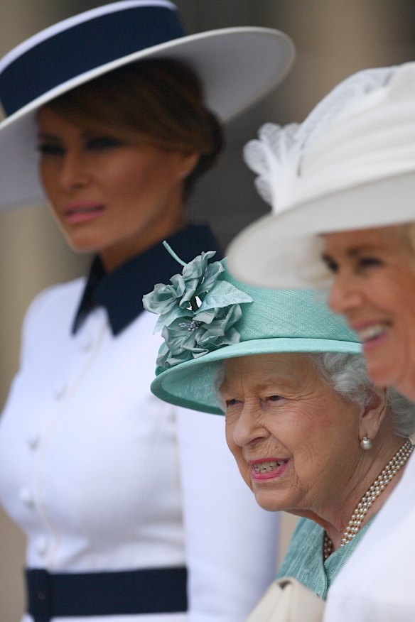 US First Lady Melania Trump, left, attends a welcome ceremony with the Queen and Camilla, Duchess of Cornwall, right, in the garden of Buckingham Palace.