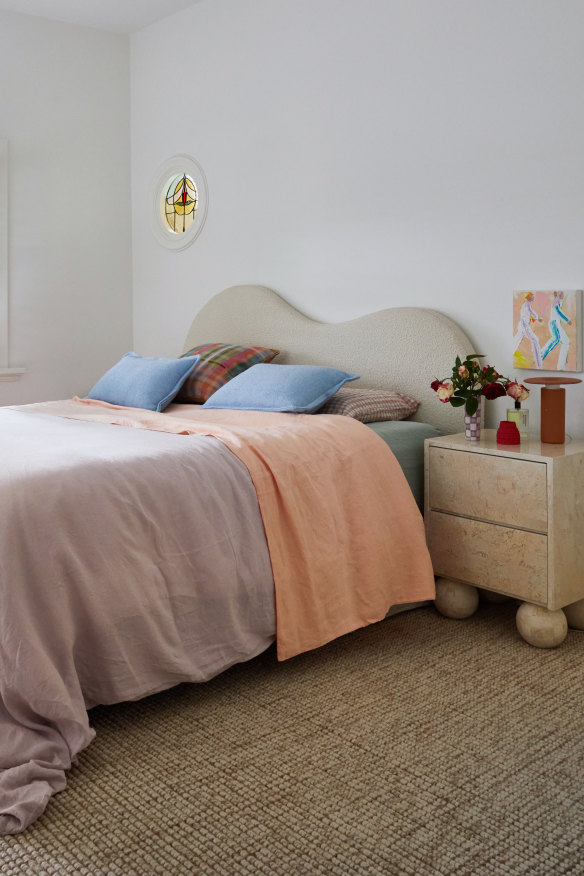 “We converted the front room of the house into our bedroom and have the kids’ rooms upstairs,” says Kerri.  The bedhead is by McMullin+Co and the linen is from Dazed but Amazed.