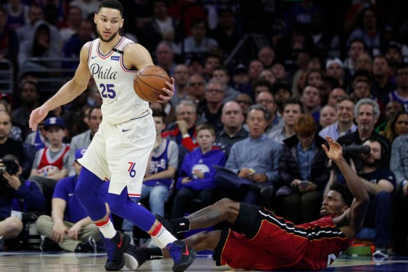 Ben Simmons tangles with Miami's Justise Winslow.