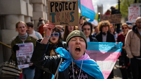Trans rights activists protest against the ban on hormone blockers in London in April 2024, introduced after the review by Hilary Cass.
