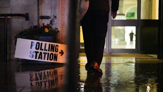 Wet. Dark. Sombre. Islington Town Hall Polling Station in  London. 