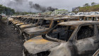 Burnt cars are lined up after unrest that erupted following protests over voting reforms in Noumea, New Caledonia.