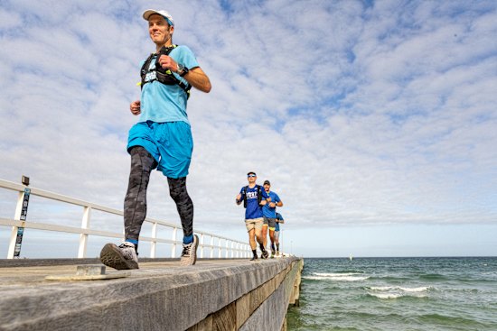 GPS-art runner Peter Mitchell and friends who just ran around the world.