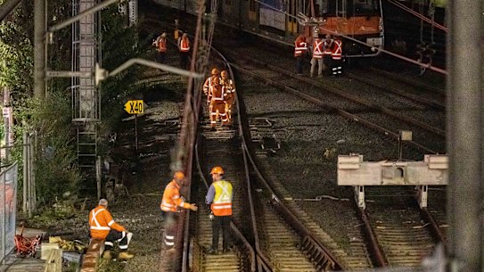 Workers near the site on Tuesday evening.