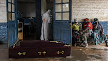 Relatives of Ebola victims sit outside the General Referral Hospital during the Ebola outbreakon May 21, 2026 in Mongbwalu, Democratic Republic of Congo. The World Health Organization (WHO) has declared the Ebola outbreak in the Democratic Republic of Congo (DRC) and Uganda a "public health emergency of international concern," as the death toll and number of confirmed cases continue to rise. The current epidemic is caused by the Bundibugyo virus