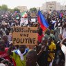 Nigeriens participate in a march called by supporters of coup leader Gen. Abdourahmane Tchiani in Niamey, Niger.