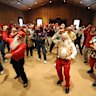 Santa Students practice dancing at the Charles W. Howard Santa Claus School workshop in Michigan.