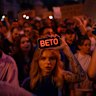 A woman holds a phone with a sign that reads “Veto” during the protest in central Kyiv on Tuesday against the law aimed at regulations of anti-corruption institutions.