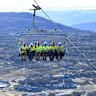 The first staff on a test run of the new Perisher ski lift.