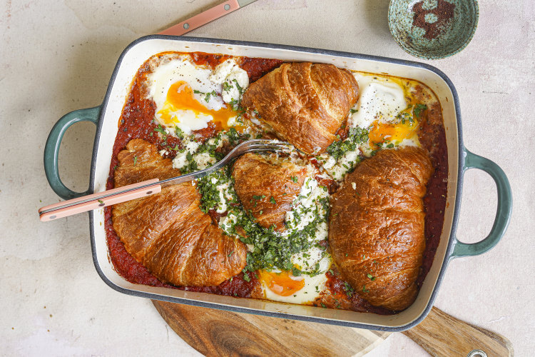 Shakshuka meets savoury bread-and-butter pudding in this share-friendly brunch dish.