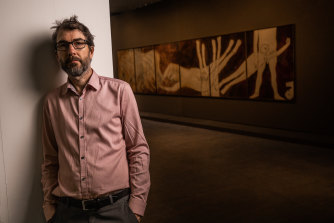 Curator Anthony Fitzpatrick devised a fresh approach to Sidney Nolan’s work in Myth Rider at the TarraWarra Museum of Art. He stands next to Troy - Dragging of Hector, 1966.