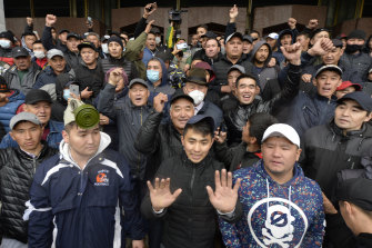 Protesters gather in front of the government headquarters on the central square in Bishkek, Kyrgyzstan, on Tuesday. Activists have seized several buildings.
