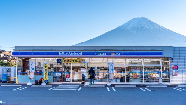 A Lawson convenience store with Mount Fuji in the background. 