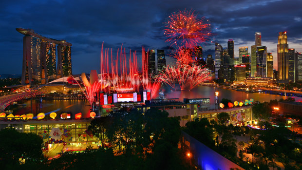 Fireworks are launched from a floating platform during Singapore's National Day Parade.