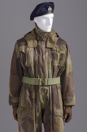 Military dress, such as this WWII tank suit, still influences men's fashion trends today.