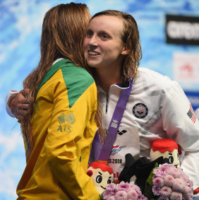 Beginning of a fine rivalry: Katie Ledecky hugs Ariarne Titmus on the podium.