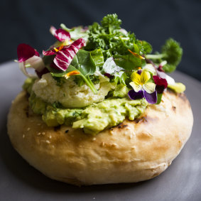 Queen's Terrace Cafe brunch offering APH turkish bread, smashed avocado, persian feta and greens.