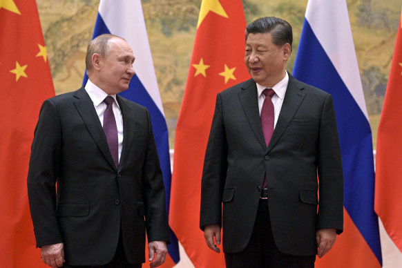 Chinese President Xi Jinping, right, and Russian President Vladimir Putin talk to each other during their meeting in Beijing in February.