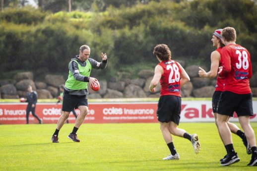 Essendon coach Ben Rutten takes training with his job under threat.