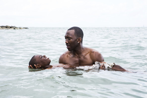 Alex Hibbert and Mahershala Ali in a scene from the film Moonlight.
