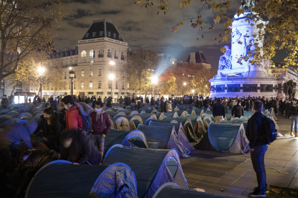 Migrants were tossed out of a makeshift camp on Place de la Republique in Paris on Monday night.
