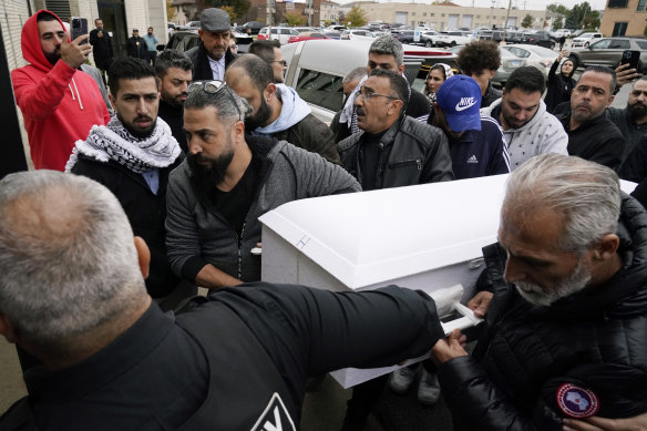 Family members of Wadea Al Fayoume carry the boy’s casket on Monday.
