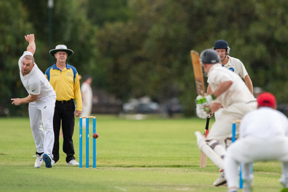 Melbourne coach Simon Goodwin bowls in the grand final between Melbourne University and STC South Camberwell.