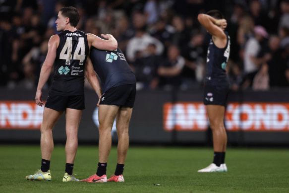 Carlton players show their dejection at the final siren of Sunday’s game.