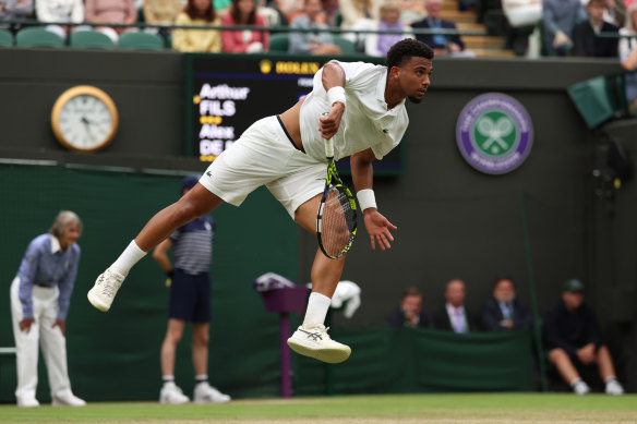 Arthur Fils serves strongly to Alex de Minaur.