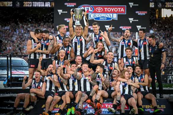 The Magpies celebrate after their 2023 premiership.