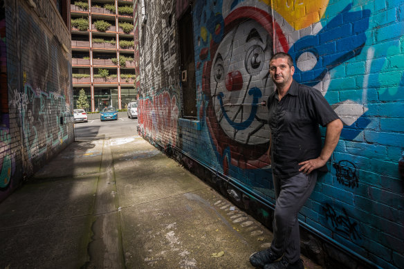 Artist Adrian Doyle in Blender Laneway which is slated to be destroyed under a development proposal.