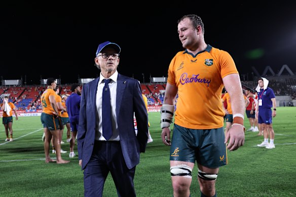 Coach Les Kiss and captain Harry Wilson show their relief after the Wallabies escaped with victory in Japan.