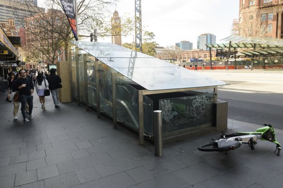 One of two out-of-operation escalators at Railway Square, with Central Station in the background.