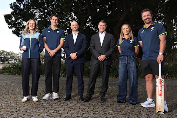 Cricket Australia chair Mike Baird and CEO Todd Greenberg pose with Sophie Molineux, Pat Cummins, Ellyse Perry and Travis Head. 