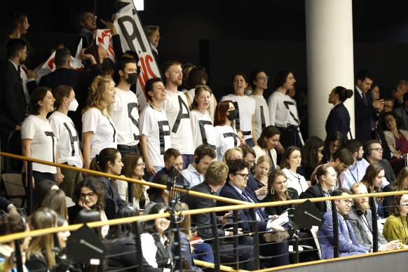 Demonstrators wear a message on their shirts that reads “this pact kills” while standing in the European Parliament visitors gallery.