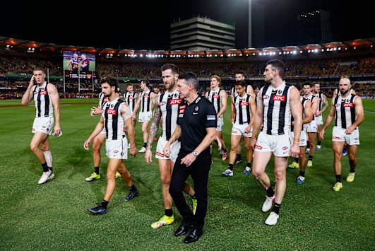 Craig McRae and his Magpies after their heavy loss to the two-time reigning premiers.
