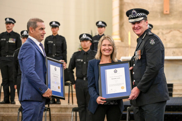 Tony and Michelle Currie receive their Citizen Commendations from Chief Commissioner Shane Patton at the Police Academy on Thursday.