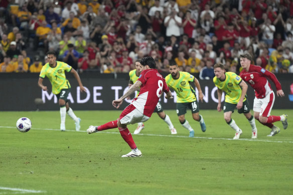Indonesia’s Kevin Diks takes the penalty kick.